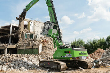 Demoltion machine excavator SENNEBOGEN 830 E selective dismantling on construction site